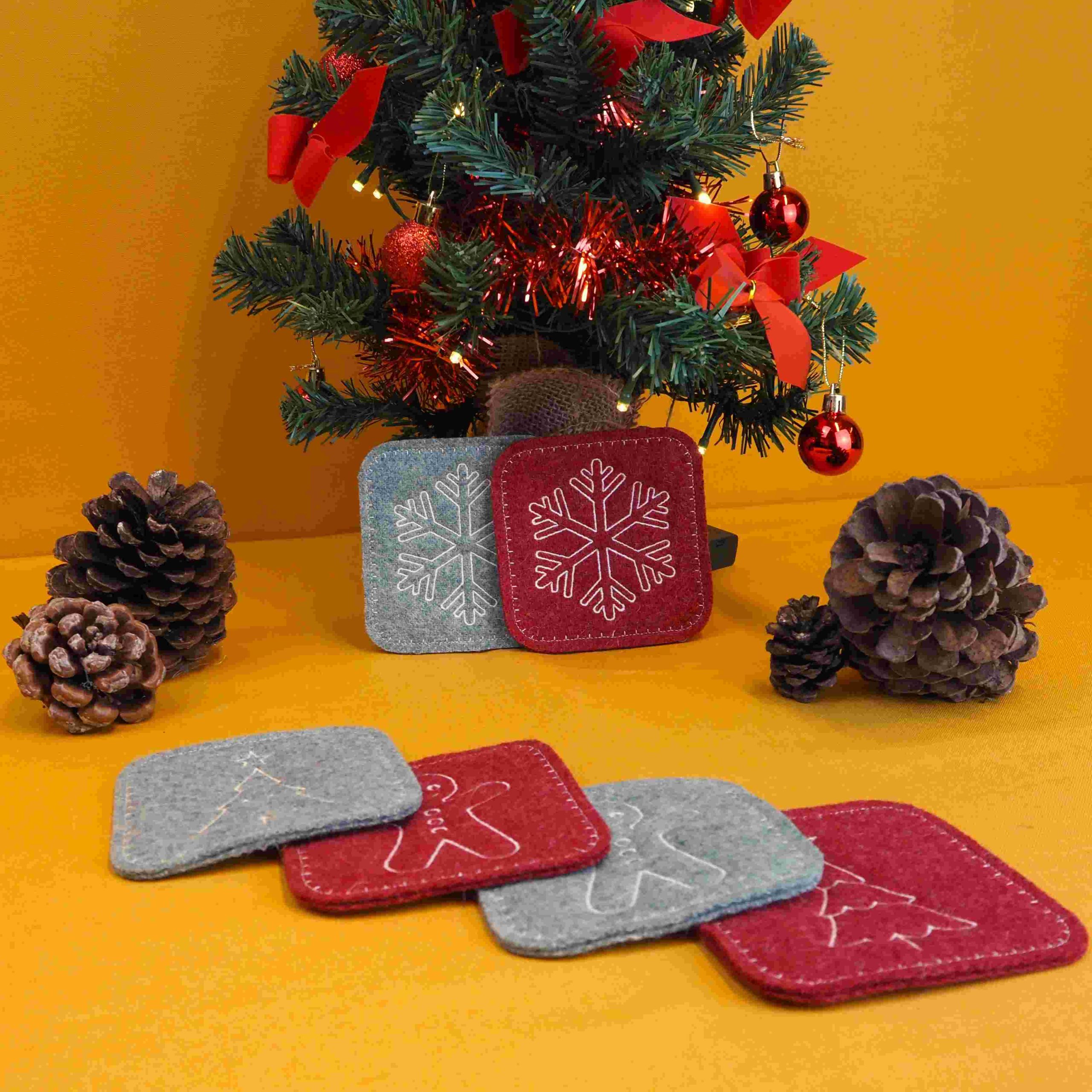 Kerstonderzetters, waarbij de sneeuwvlok goed zichtbaar is.